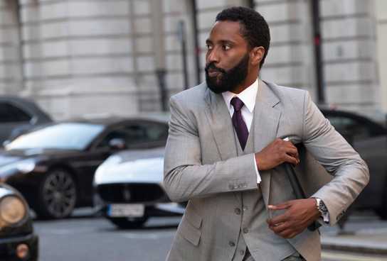 John David Washington's Protagonist in Tenet walking in the street